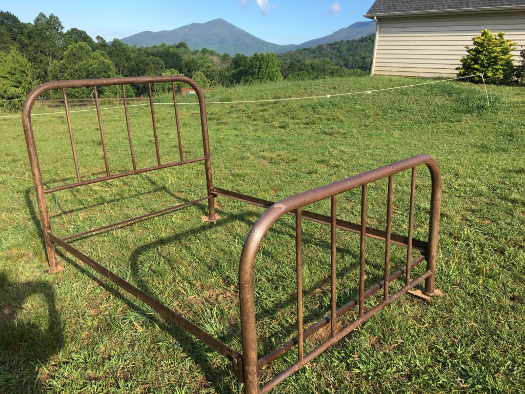 Unpainted metal bed