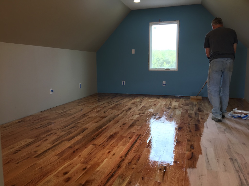 Applying polyurethane in completed room