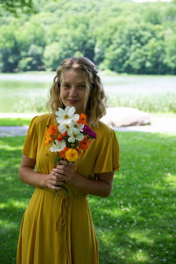 Mixed flower bouquet with mustard dress.