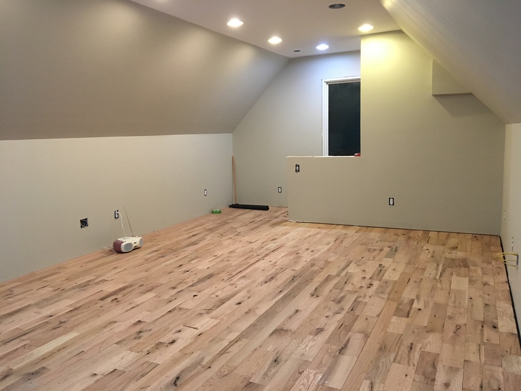 Unfinished hardwood completed in painted room