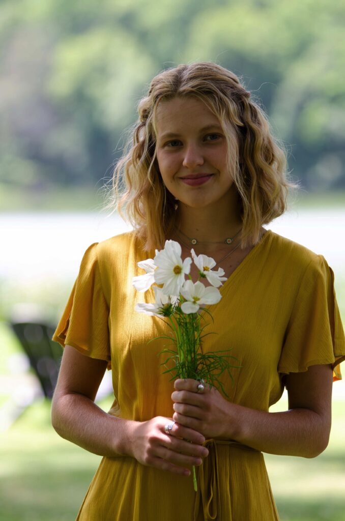 White flower bouquet with mustard dress