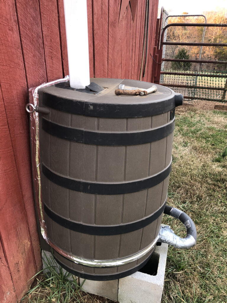 Both rain barrels connected to the automatic waterer inside the chicken coop.